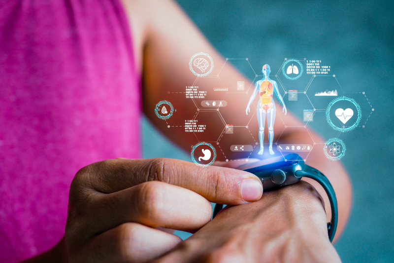 A closeup image of a man's hand with a smartwatch, trying to set the health monitor app on it and virtual images related to a health app displayed above the watch screen.