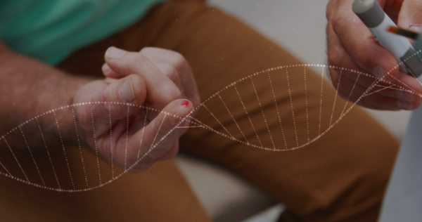 A person sitting in a lab/home with a needle prick in his right hand index finger and another person holding the glucometer with a hologram image of DNA strand across the image.