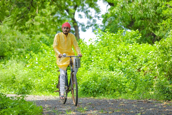 A person cycling to work, reducing carbon dioxide emissions and supporting a cleaner environment.