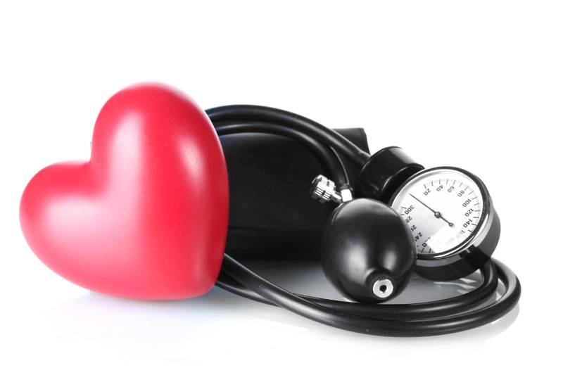 A blood pressure kit with a red heart, signifying the risk of heart disease from unmanaged high blood pressure.