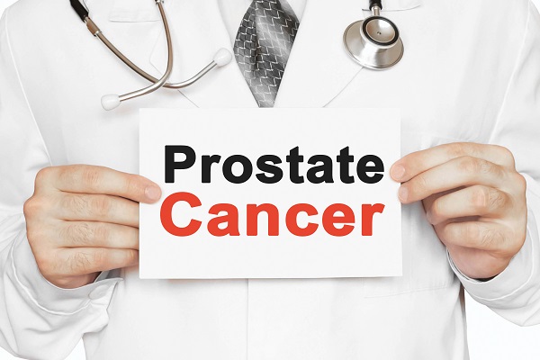 Doctor holding a 'Prostate Cancer' sign to represent PSA testing in older men