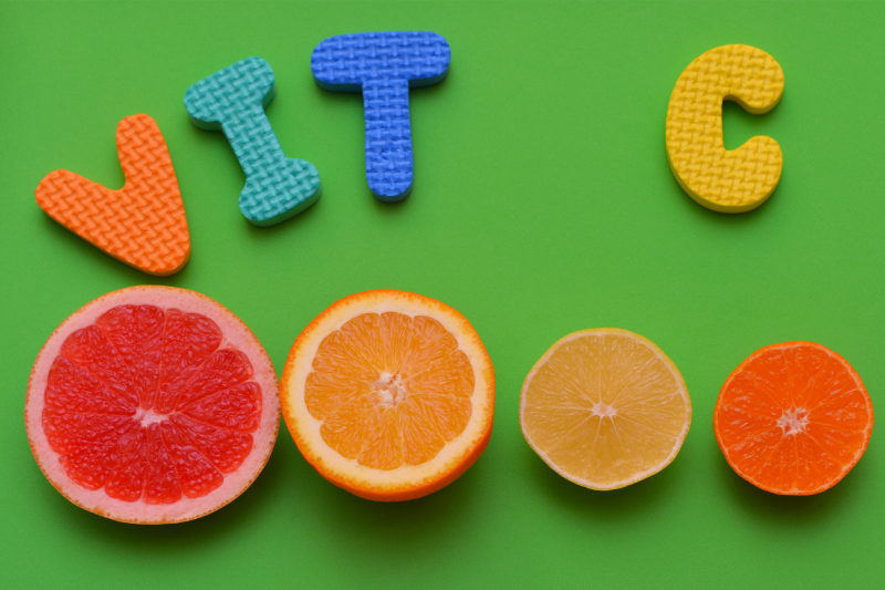 Citrus slices with 'VIT C' text, highlighting vitamin C for an arthritis-friendly diet.